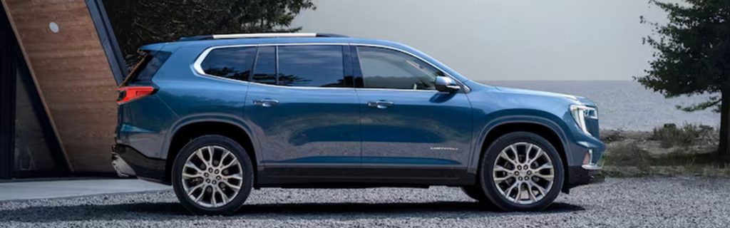 2025 GMC Acadia parked in front of the beach