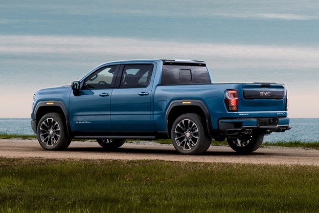 2027 GMC Sierra 1500 parked on a scenic lakeside landscape.